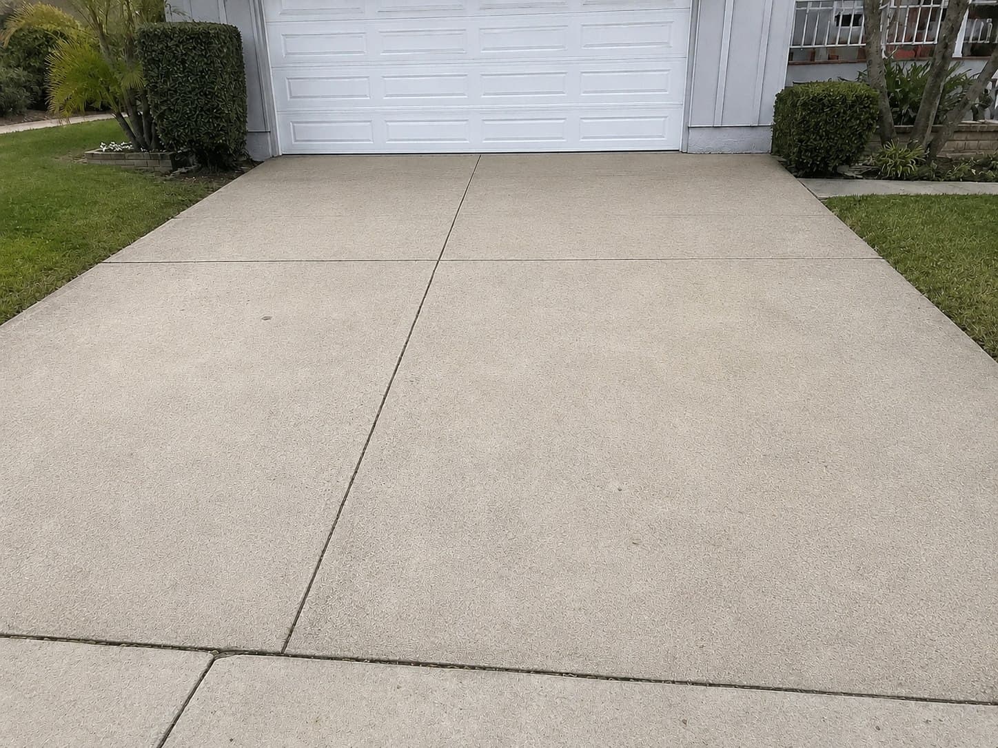 Clean driveway concrete after Washwell pressure washing